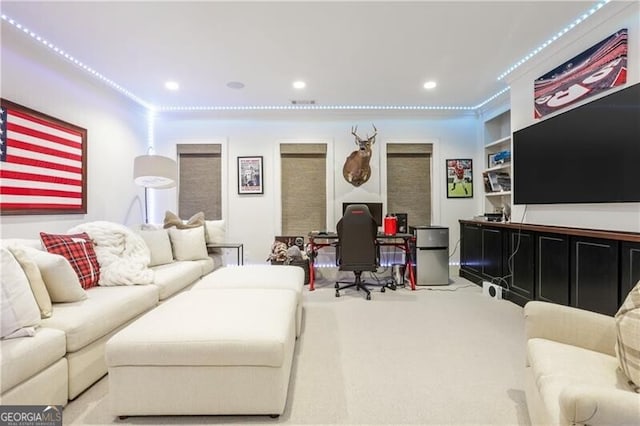 carpeted living room featuring built in shelves