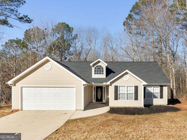 view of front of home featuring driveway, a garage, a front lawn, and roof with shingles