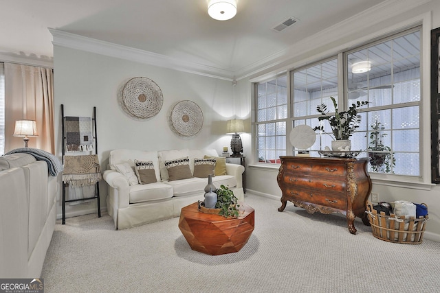 carpeted living room featuring ornamental molding