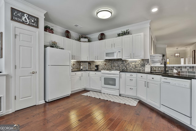 kitchen with sink, dark wood-type flooring, tasteful backsplash, white appliances, and white cabinets