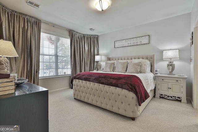 bedroom featuring light colored carpet