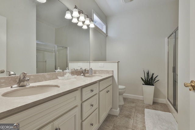 bathroom with tile patterned flooring, vanity, toilet, and a shower with door