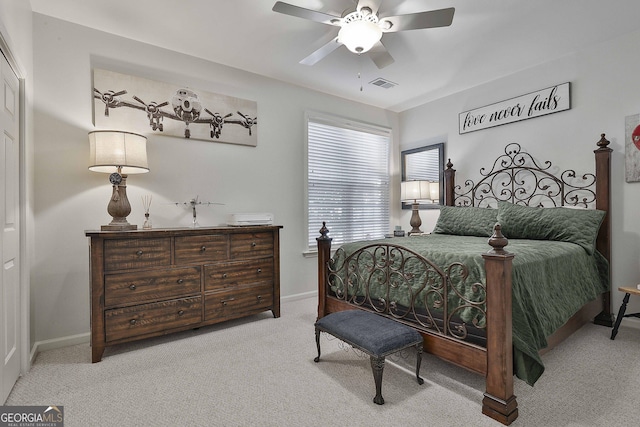 bedroom featuring ceiling fan and light colored carpet