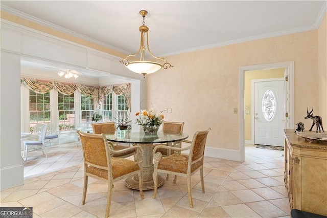 tiled dining room featuring crown molding