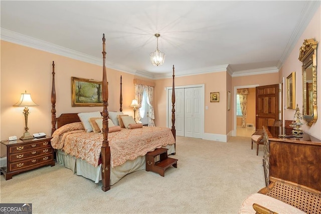 bedroom featuring light carpet, ensuite bathroom, a closet, and crown molding