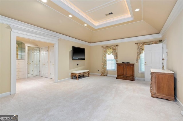 interior space featuring a tray ceiling and crown molding