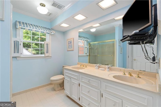 bathroom with toilet, vanity, a shower with shower door, and ornamental molding