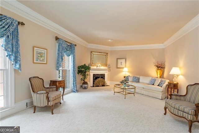 carpeted living room with a wealth of natural light and crown molding