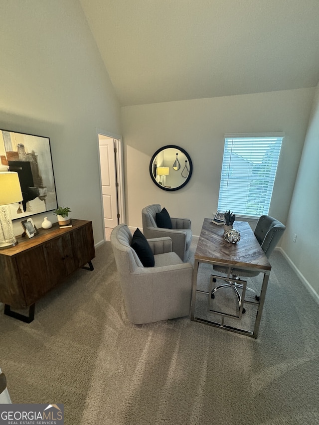 living room with high vaulted ceiling and carpet