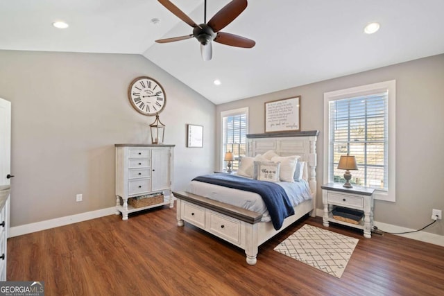 bedroom featuring multiple windows, ceiling fan, dark hardwood / wood-style flooring, and lofted ceiling