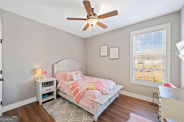 bedroom with ceiling fan and hardwood / wood-style flooring