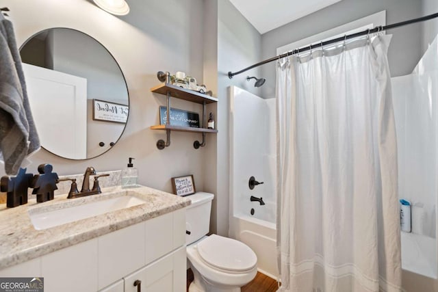 full bathroom with vanity, toilet, and shower / bath combo with shower curtain