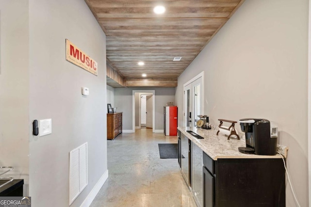 corridor with wood ceiling