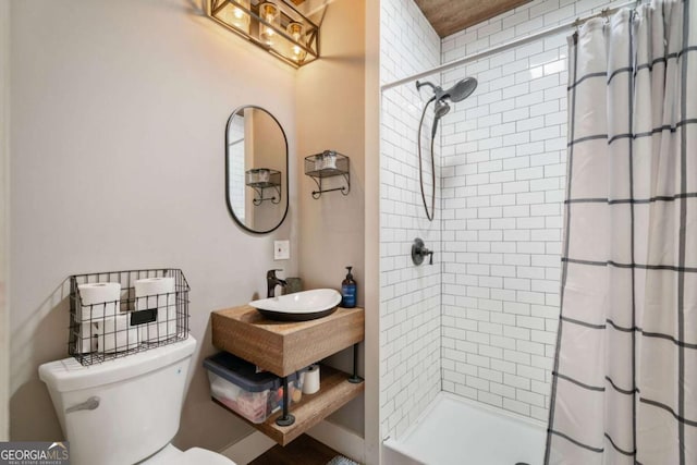 bathroom featuring sink, toilet, and walk in shower