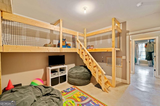 bedroom featuring concrete floors