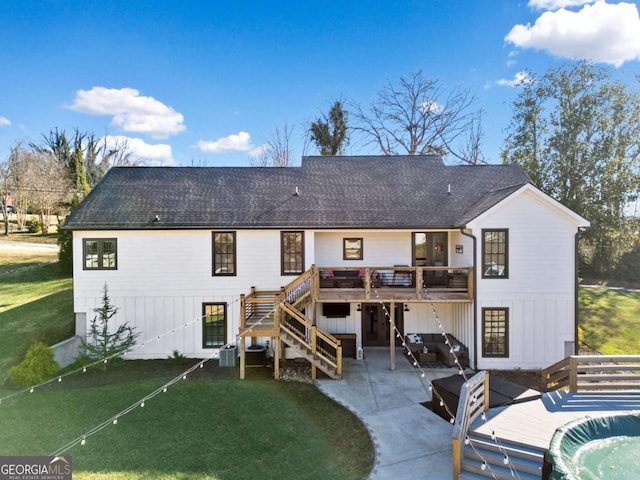 rear view of property with a patio area, a yard, and a deck