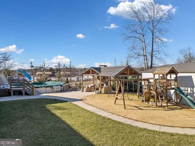 view of play area with a lawn, an outdoor hangout area, and a patio