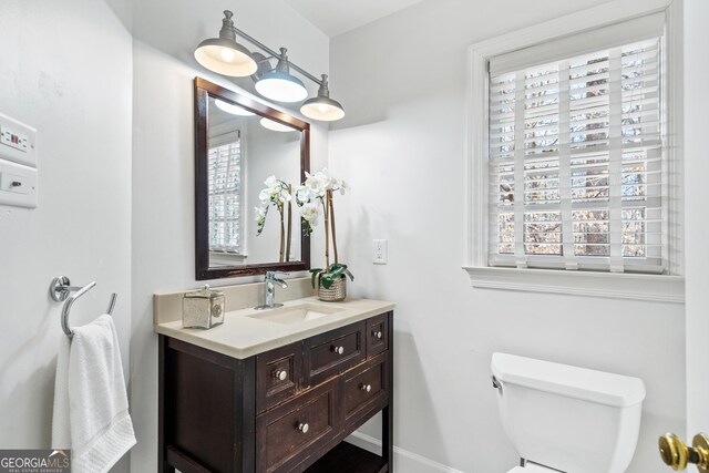 bedroom featuring a closet, ceiling fan, ornamental molding, and light colored carpet