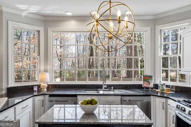 dining room with a wealth of natural light, crown molding, and dark hardwood / wood-style floors