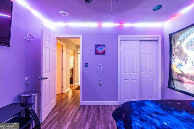 bedroom featuring a closet and hardwood / wood-style floors