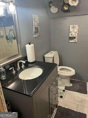 bathroom with vanity and toilet