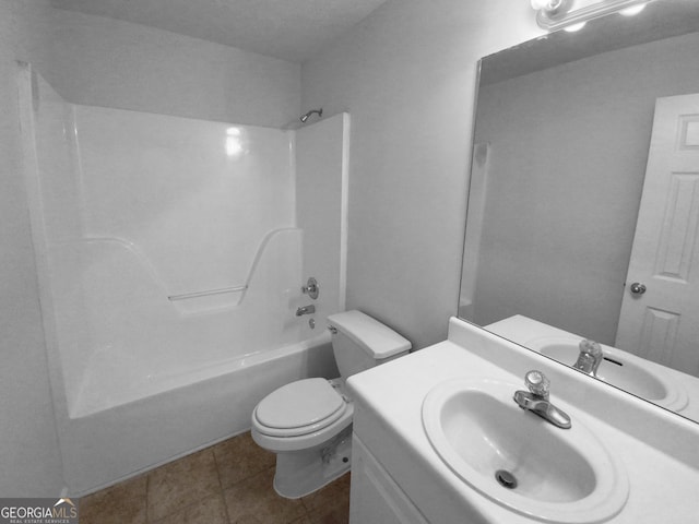 full bathroom with tile patterned floors, vanity, bathtub / shower combination, and toilet