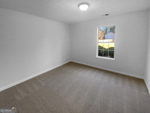 unfurnished room featuring carpet flooring