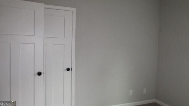 unfurnished bedroom featuring a closet