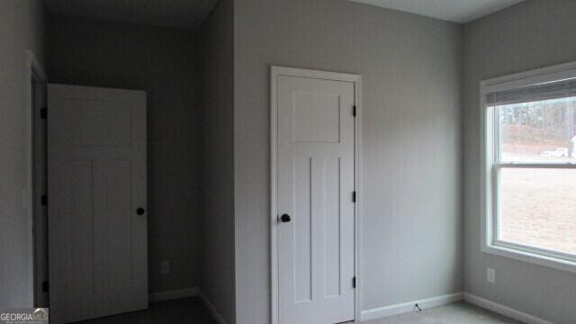 unfurnished bedroom with a closet