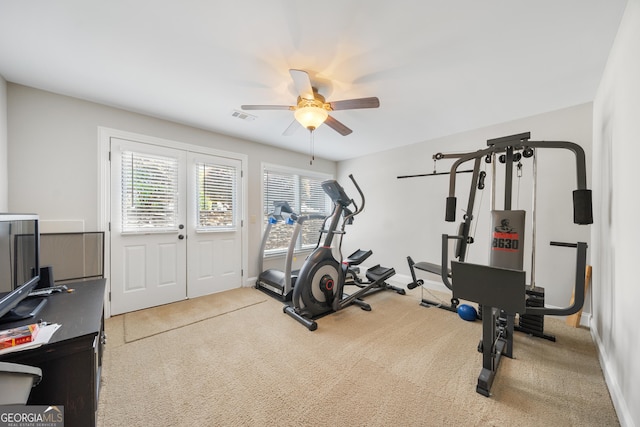 exercise area featuring carpet flooring and ceiling fan