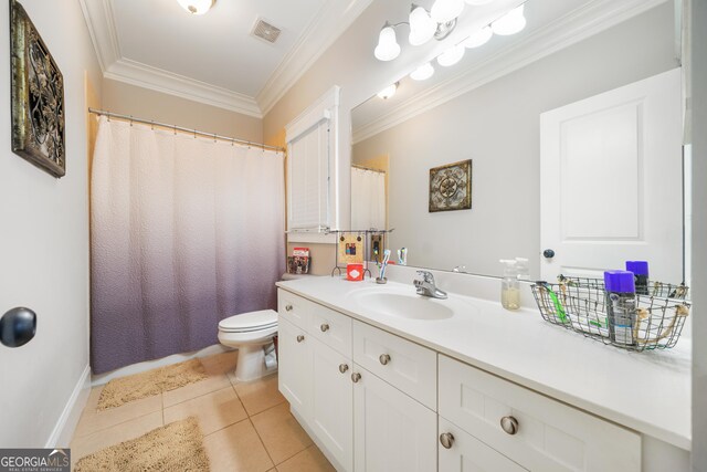 bathroom with tile patterned floors, vanity, toilet, and ornamental molding