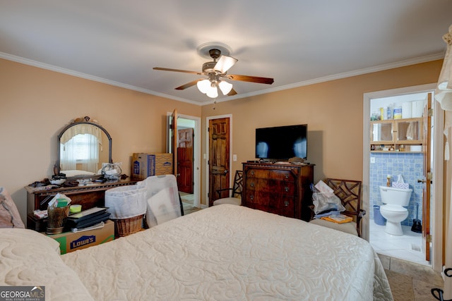 tiled bedroom featuring ceiling fan, ensuite bathroom, and ornamental molding