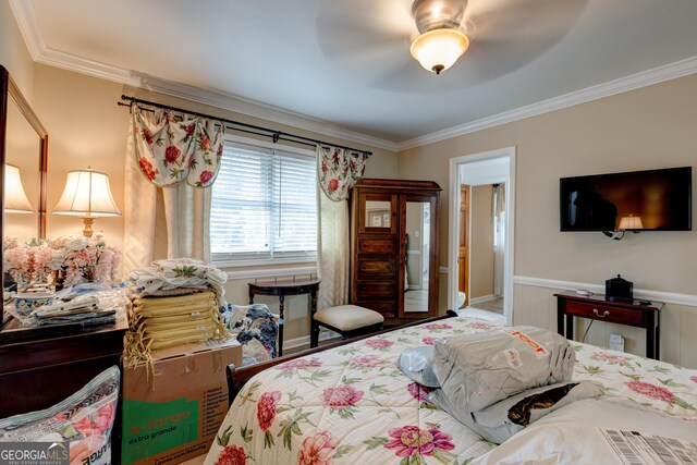 bedroom featuring ceiling fan and crown molding