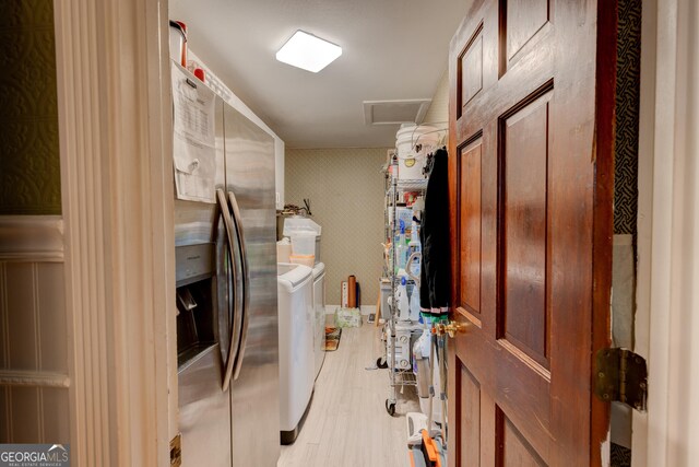 washroom featuring separate washer and dryer and light wood-type flooring