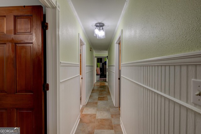 corridor featuring crown molding