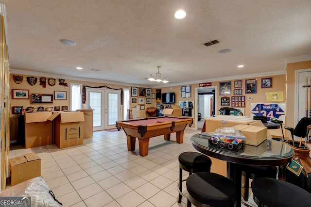 recreation room with french doors, crown molding, and billiards