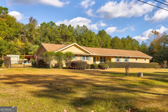 ranch-style house with a front lawn