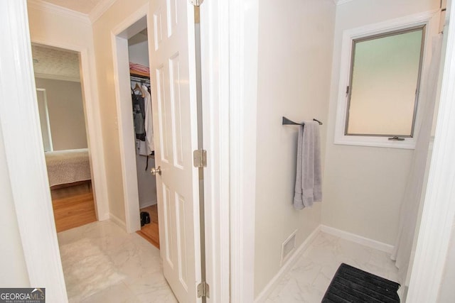 bathroom featuring crown molding