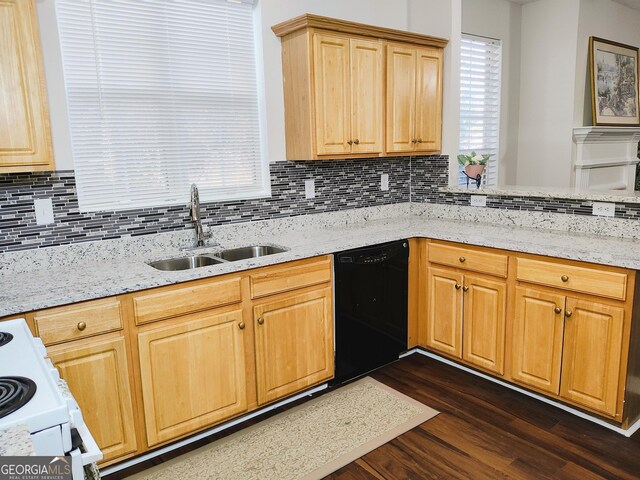 kitchen featuring dishwasher, dark hardwood / wood-style flooring, tasteful backsplash, and sink