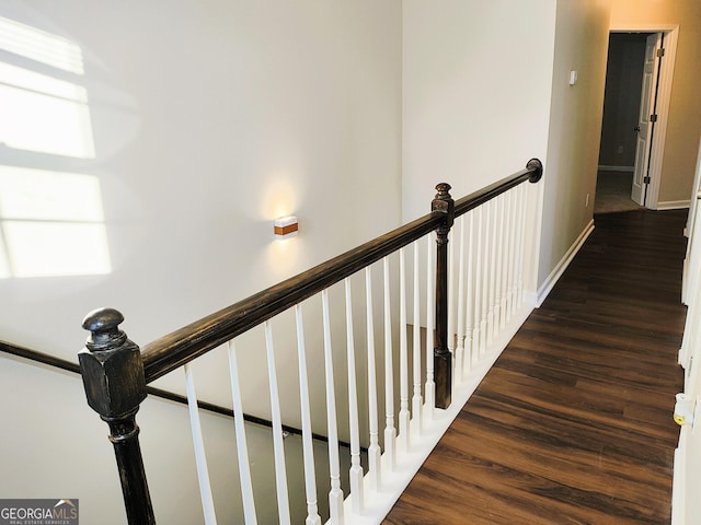 stairs with wood-type flooring