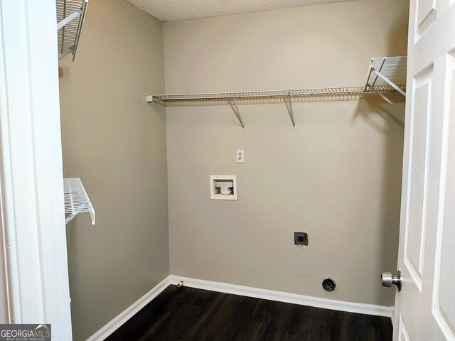 laundry room with hardwood / wood-style floors, washer hookup, a textured ceiling, and hookup for an electric dryer