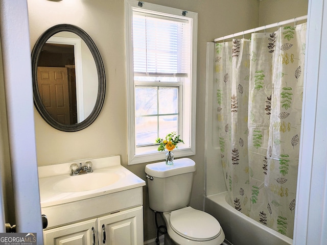 full bathroom with shower / bath combination with curtain, toilet, and vanity