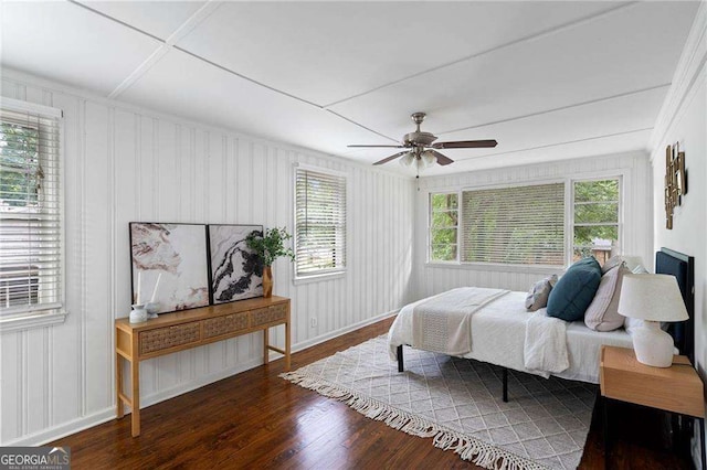 bedroom featuring ceiling fan and dark hardwood / wood-style flooring