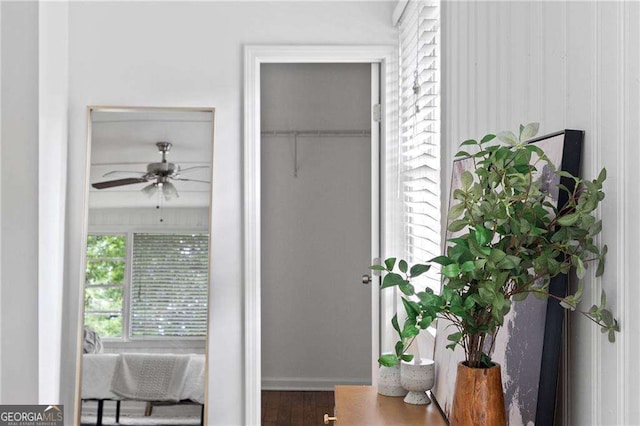 interior space with hardwood / wood-style floors and ceiling fan