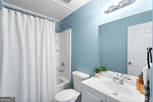 full bathroom featuring vanity, toilet, shower / bath combo with shower curtain, and crown molding