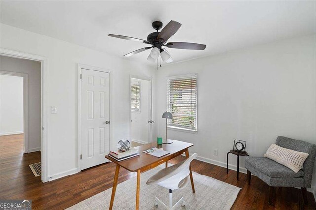 office area with dark hardwood / wood-style floors and ceiling fan