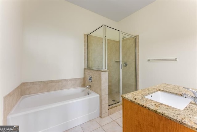 bathroom featuring vanity, tile patterned floors, and separate shower and tub