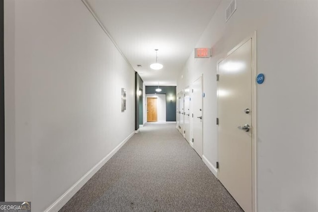 hallway with light carpet