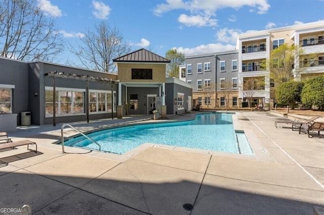 view of swimming pool with a patio