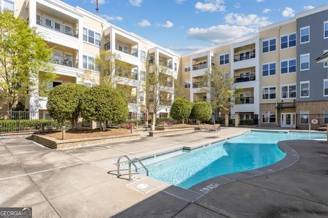 view of pool featuring a patio area